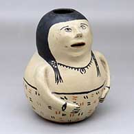 A polychrome woman effigy pot
 by Unknown of Cochiti