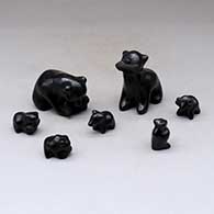 A set of seven black bears, some with fish in their mouths
 by Dorothy Gutierrez of Santa Clara