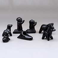 A miniature seven-piece matte and polished black Nativity set, click or tap to see a larger version