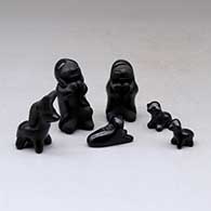 A miniature matte and polished black six-piece Nativity set
 by Dorothy Gutierrez of Santa Clara