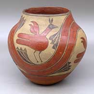 A polychrome jar decorated with a four-panel roadrunner, rainbow and cloud formation design
 by Unknown of Zia
