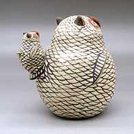 A polychrome owl figure with a chick sitting on its tail, click or tap to see a larger version