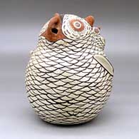 A polychrome owl figure with a chick sitting on its tail, click or tap to see a larger version