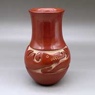 A tall neck red water jar carved around the shoulder with an avanyu design
 by Jennie Trammel of Santa Clara