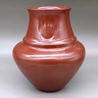 A large red double-shouldered jar with a recurved neck and decorated with three bear paw imprints on the neck
 by Margaret Tafoya of Santa Clara