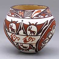 A small polychrome jar decorated with a four-panel rosette and deer-with-heart-line-in-his-house, rain bird and geometric design
 by Jennie Laate of Zuni