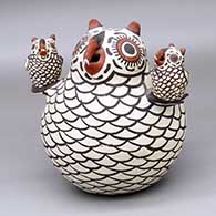 A classic Zuni polychrome owl storyteller figure with two chicks
 by Nellie Bica of Zuni