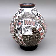 Polychrome jar with a flared opening and a three-panel painted geometric design over a sgraffito textured background
 by Oscar Gonzales Quezada Jr of Mata Ortiz and Casas Grandes