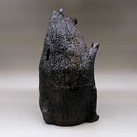 A large brown bear piggy bank with fire clouds and pinon pitch coating, click or tap to see a larger version