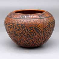 A black on red bowl decorated with a small sherd and geometric design
 by Rondina Huma of Hopi