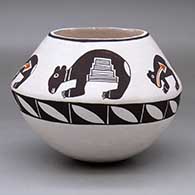A polychrome bowl decorated with a geometric design below the shoulder and a four-panel bear-with-heart-line design above the shoulder
 by Emma Lewis of Acoma