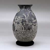 A black on white jar decorated with a sgraffito Night of the Dead at the Cemetery design, click or tap to see a larger version