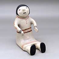A polychrome sitting Singing Mother figure
 by Aurelia Suina of Cochiti
