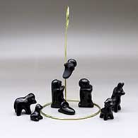 A nine-piece nativity set with a hanging angel, click or tap to see a larger version