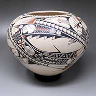 A polychrome jar decorated with a four-panel Mimbres geometric design
 by Ismael Flores Jr of Mata Ortiz and Casas Grandes