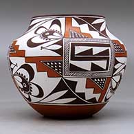 A polychrome jar decorated with a three-panel geometric design, click or tap to see a larger version