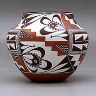A polychrome jar decorated with a three-panel geometric design, click or tap to see a larger version