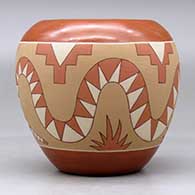 A polychrome jar decorated with a sgraffito and painted avanyu, lizard and geometric design, click or tap to see a larger version