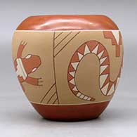 A polychrome jar decorated with a sgraffito and painted avanyu, lizard and geometric design, click or tap to see a larger version