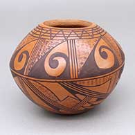Small red and black jar with a geometric design
 by Roberta Silas of Hopi