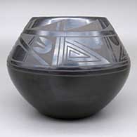 A black on black jar with a geometric design, click or tap to see a larger version
