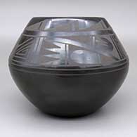 A black on black jar with a geometric design, click or tap to see a larger version