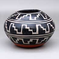 A polychrome jar with three bands of geometric design circling the body
 by Robert Tenorio of Santo Domingo