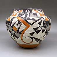 A polychrome jar decorated with a four panel bird element and geometric design, click or tap to see a larger version