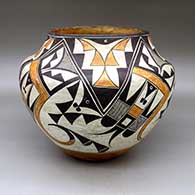 A polychrome jar decorated with a four panel bird element and geometric design
 by Unknown of Acoma