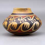 A polychrome jar decorated around the body with a migration pattern design, click or tap to see a larger version