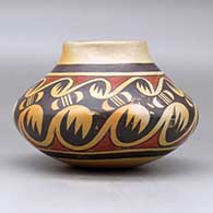 A polychrome jar decorated around the body with a migration pattern design, click or tap to see a larger version