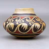 A polychrome jar decorated around the body with a migration pattern design, click or tap to see a larger version
