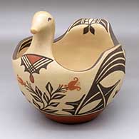 A polychrome bird bowl decorated with a bird element and geometric design
 by Eleanor Pino Griego of Zia