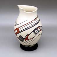 Polychrome jar with an organic opening and a geometric design
 by Lydia Quezada of Mata Ortiz and Casas Grandes