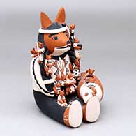 A sitting fox storyteller with a turtle and 14 tiny fox appliques
 by Dena Suina of Cochiti