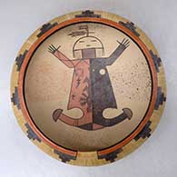 A polychrome bowl decorated above the shoulder with a geometric design and on the inside with a female yeibichai and geometric design
 by Ida Sahmie of Dineh