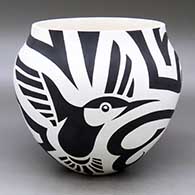 A black on  white jar decorated with a bird element, spiral and geometric design
 by Eric Lewis of Acoma