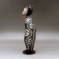 Old man caterpillar with seven earrings and decorated with a geometric design and a custom stand, click or tap to see a larger version