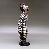 Old man caterpillar with seven earrings and decorated with a geometric design and a custom stand, click or tap to see a larger version