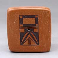 A black on red box decorated on two sides with kachina geometric designs
 by Rachel Sahmie of Hopi
