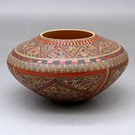 A polychrome high-shoulder jar decorated with a small sherd, crosshatching and geometric design
 by Rondina Huma of Hopi