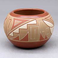 A small polychrome Potsuwii bowl decorated with a lightly carved and painted four panel kiva step, cloud and geometric design
 by Alvin Curran of Ohkay Owingeh
