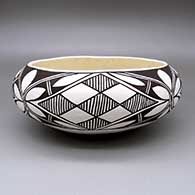 Black-on-white bowl with a four-panel fine line, checkerboard, and geometric design
 by Evelyn Ortiz of Acoma
