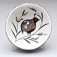 A small polychrome bowl with a quail, plant and geometric design inside, and an eight-panel geometric design outside
 by Rebecca Lucario of Acoma