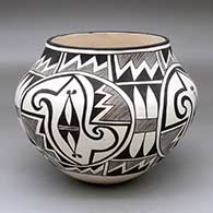 A black-on-white jar decorated with a four-panel medallion, fine line and geometric design
 by Rose Chino Garcia of Acoma