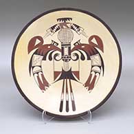 A polychrome plate decorated with a thunderbird and bird element design
 by Valerie Kahe of Hopi