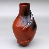 A brown vase with fire clouds and a carved wavy line on one side 
 by Melissa Johnson and Jerome Begay of Dineh