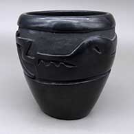 Black water jar carved with an avanyu design
 by Mida Tafoya of Santa Clara