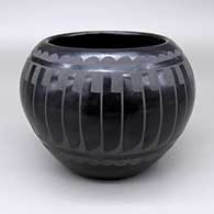 Black-on-black bowl with a feather ring and geometric design
 by Carlos Sunrise Dunlap of San Ildefonso