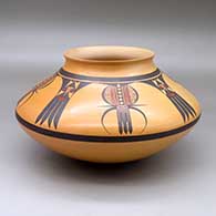 A polychrome Sikyatki-style jar decorated above the shoulder with an eight-panel katsina, feather and water beetle design
 by Steve Lucas of Hopi